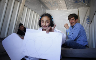 Solaf, a Syrian refugee, draws inside the caravan where she lives with her brother and parents at Azraq refugee camp. What she misses most about Syria is her grandfather. © UNHCR / A. SAKKAB