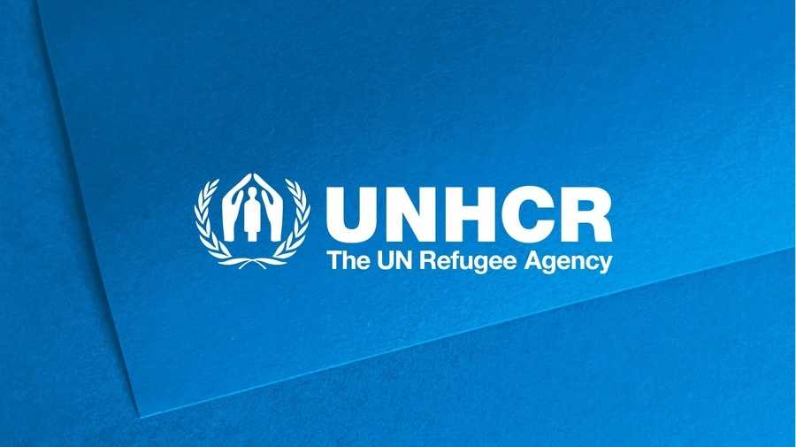 The UNHCR logo on a blue background.