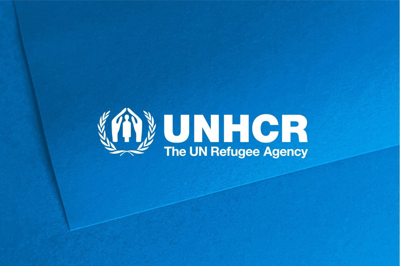 UNHCR logo in white on a light blue background